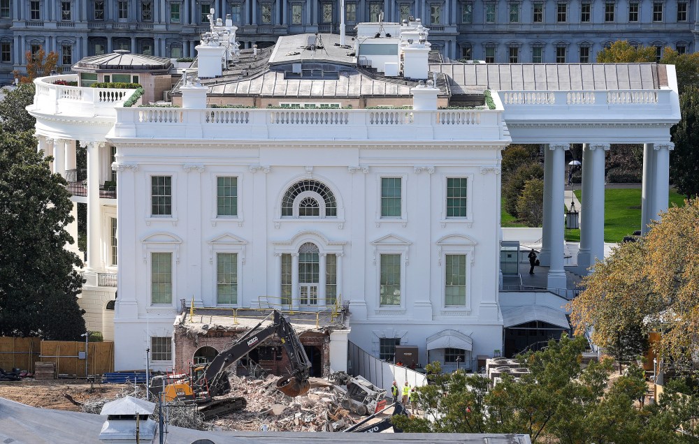 An excavator works to clear rubble after the East Wing of the White House was demolished on Oct. 23, 2025.