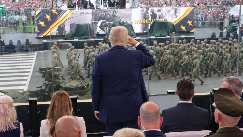 President Donald Trump salutes Army troops on the National Mall.