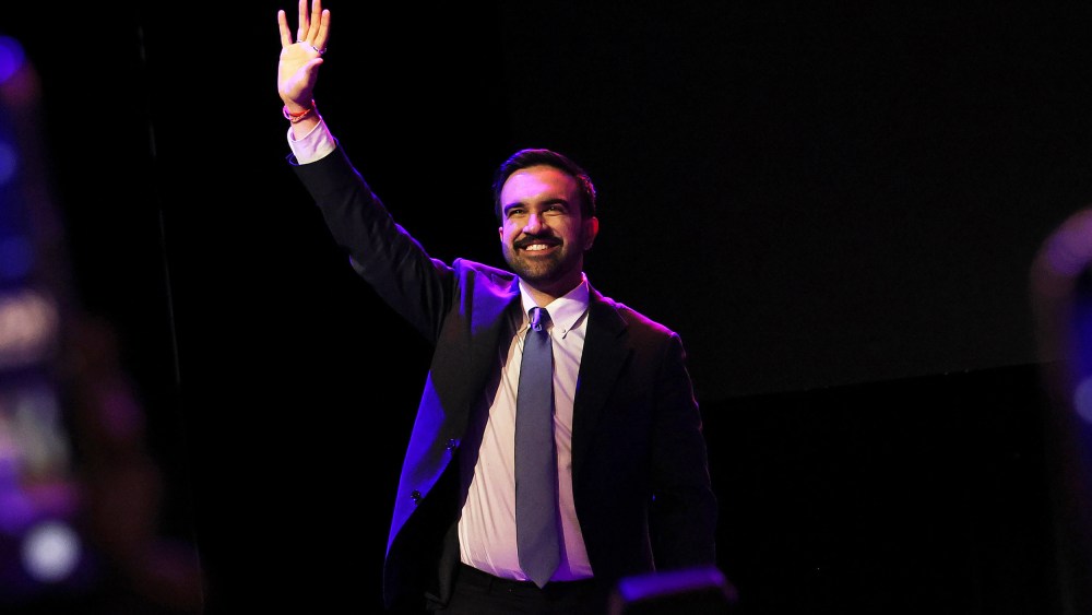 Zohran Mamdani waving to the crowd in Brooklyn, NYC.