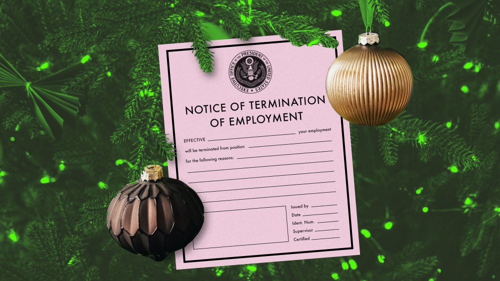 A photo illustration of a pink slip hanging among ornaments on a Christmas tree