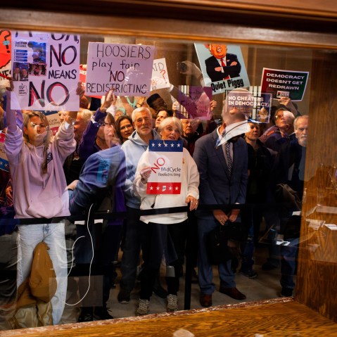 Demonstrators protest at the Indiana Statehouse in Indianapolis, I.N., on Dec. 8, 2025.