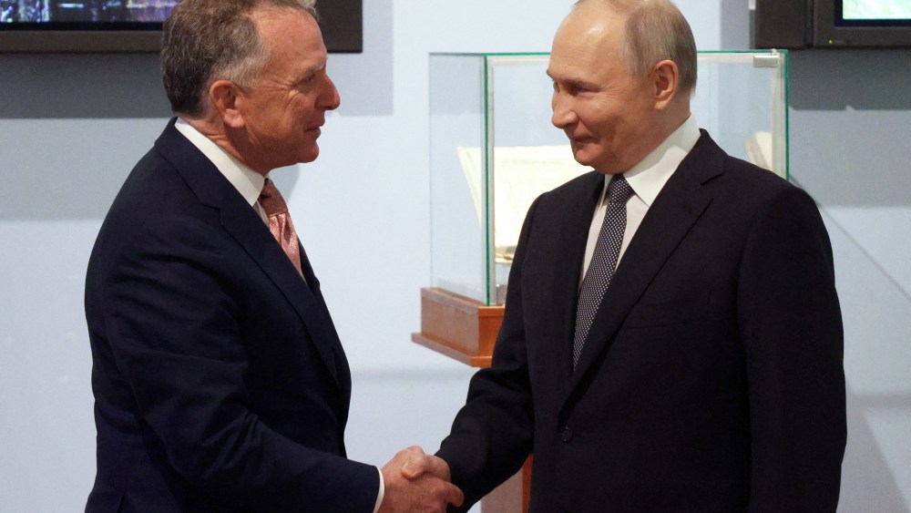 Russia’s President Vladimir Putin shakes hands with U.S. President Donald Trump’s envoy Steve Witkoff.