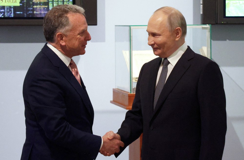 Russia’s President Vladimir Putin shakes hands with U.S. President Donald Trump’s envoy Steve Witkoff.