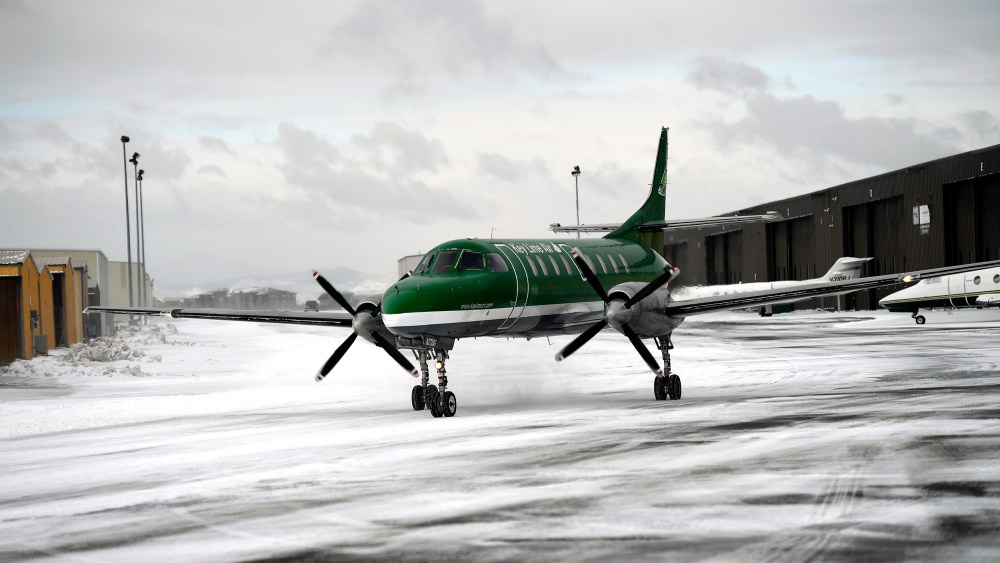 An aircraft from Key Lime Air taxies to the runway at Centennial Airport in snowy Centennial, C.O.