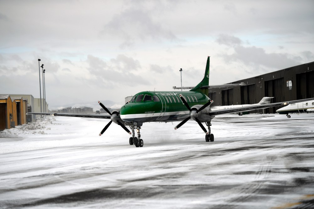 An aircraft from Key Lime Air taxies to the runway at Centennial Airport in snowy Centennial, C.O.