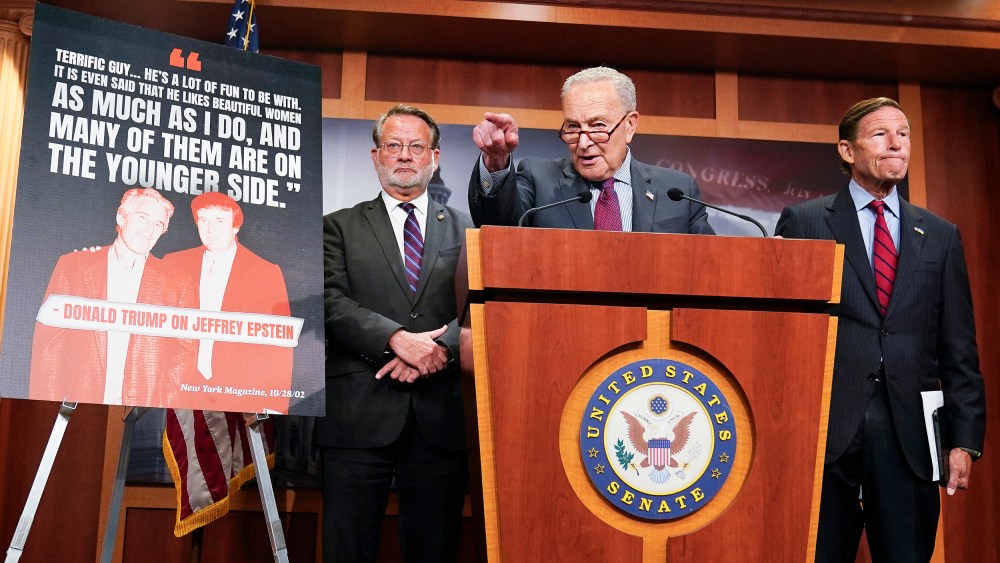 US Senate Minority Leader Chuck Schumer (C), alongside Senator Gary Peters (L), and Senator Richard Blumenthal (R), speaking during a news conference calling on the Trump administration to release further information on the Jeffrey Epstein case on July 30, 2025 at the US Capitol.