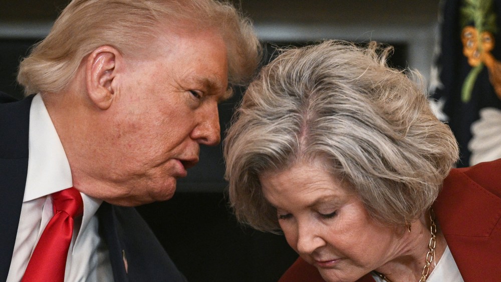 President Donald Trump leans in to speak with White House Chief of Staff Susie Wiles at the White House.