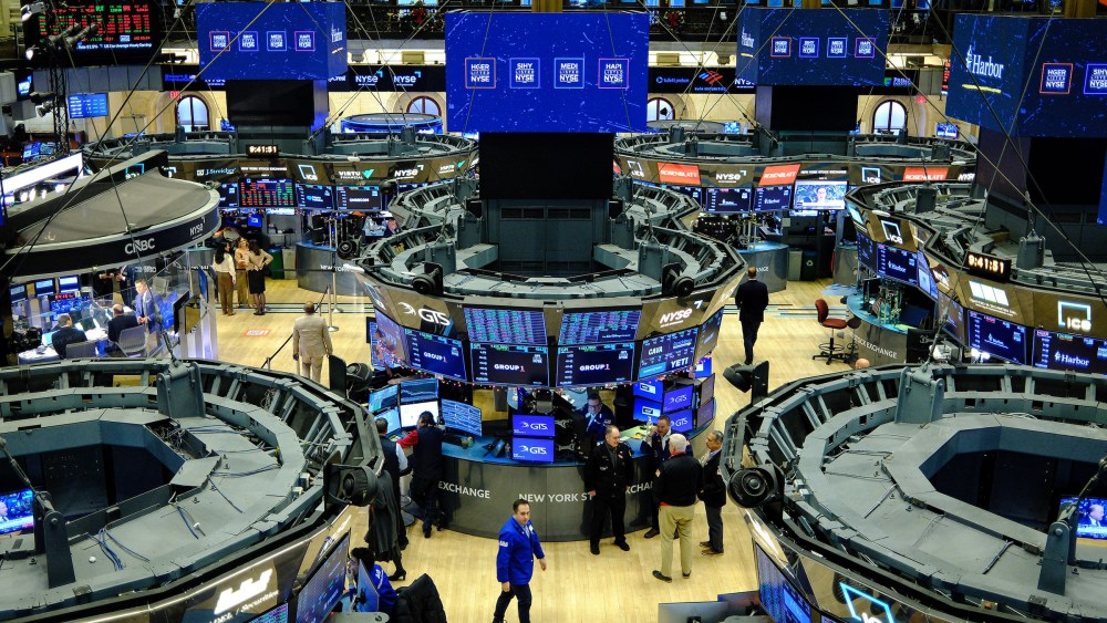 Traders work on the floor of the New York Stock Exchange at the opening bell in New York.