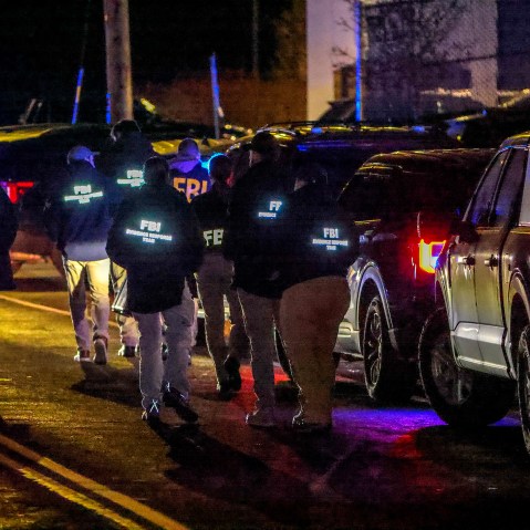A team of FBI agents arrive on the scene at the Extra Space Storage facility in Salem, N.H.