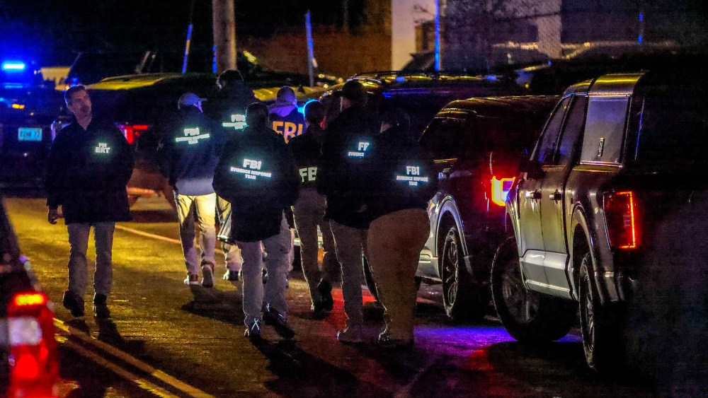 A team of FBI agents arrive on the scene at the Extra Space Storage facility in Salem, N.H.