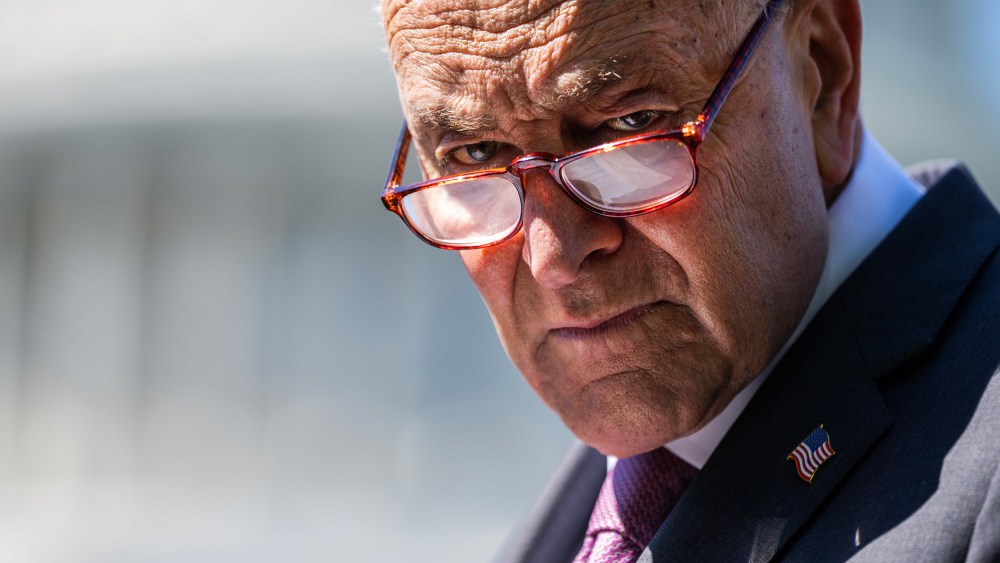 Senate Minority Leader Chuck Schumer attends a news conference outside the Capitol.