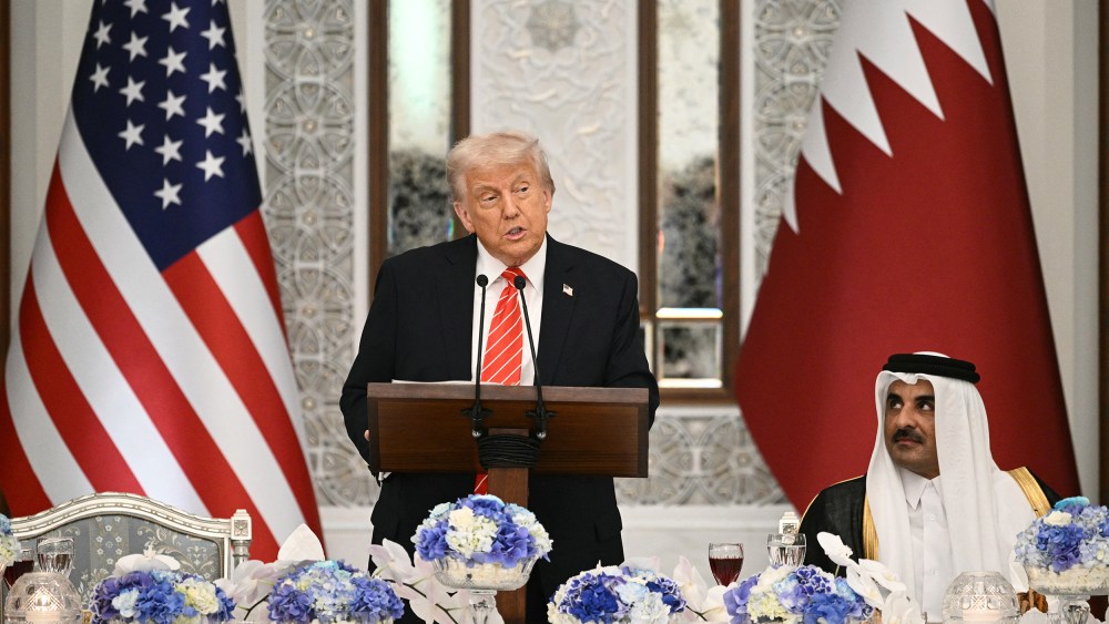 President Donald Trump and Qatar's Emir Sheikh Tamim bin Hamad al-Thani at a state dinner at the Lusail Palace in Doha, Qatar.