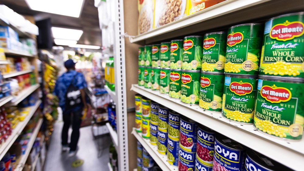 Canned food and other products in an aisle at a grocery store in NY