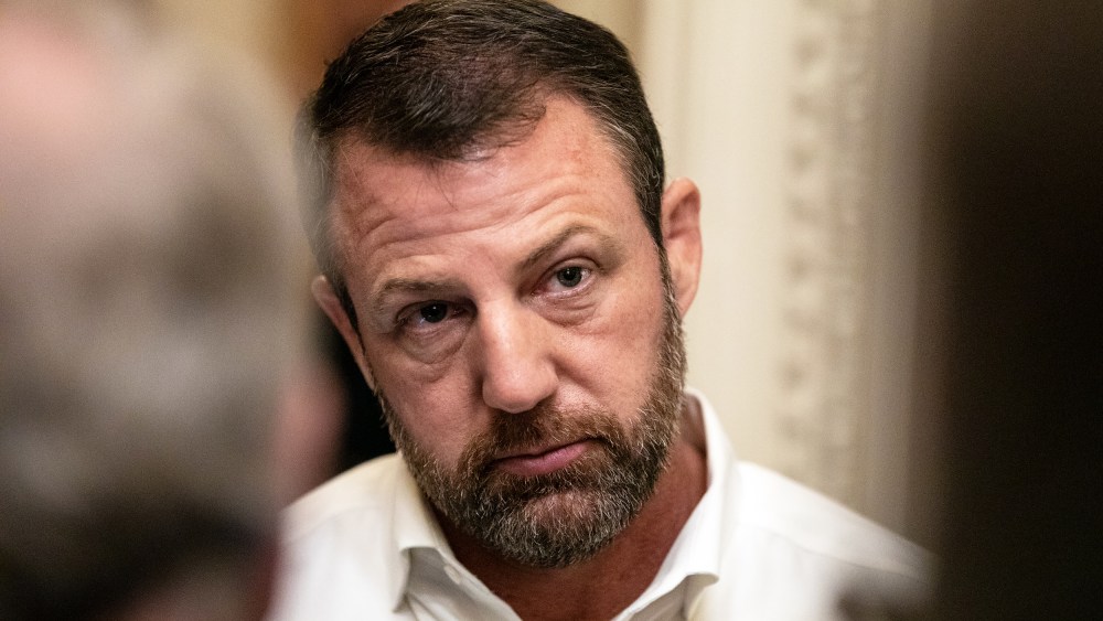 Sen. Markwayne Mullin speaks to reporters on Capitol Hill.