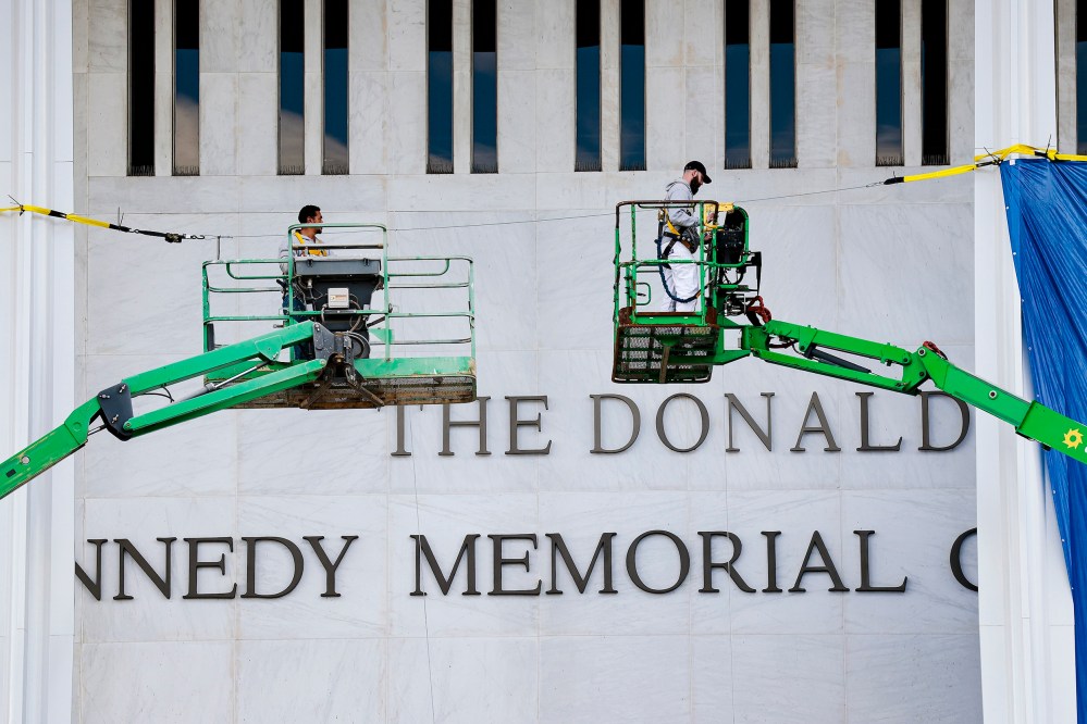 Workers adjust the name of the “John F. Kennedy Memorial Center for the Performing Arts" on Dec. 19, 2025, in Washington, D.C.