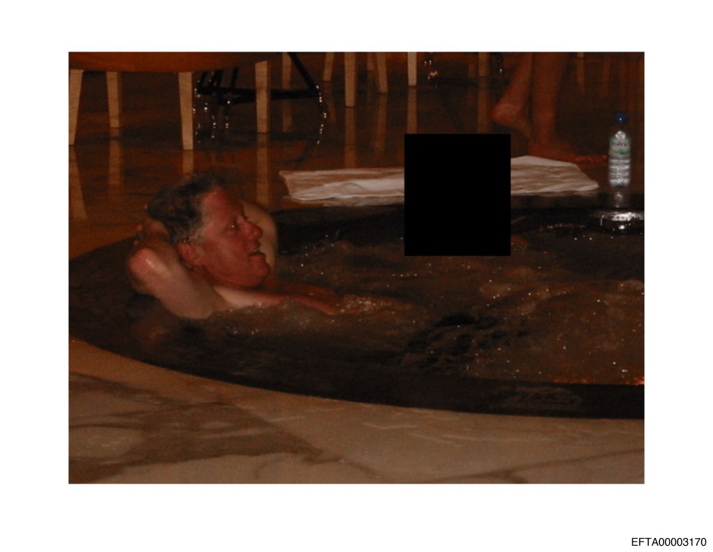 Bill Clinton in a hot tub with an unidentified person.