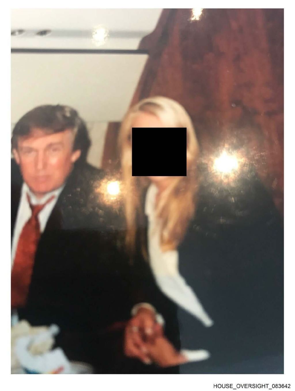 A photo of Donald Trump and an unnamed woman