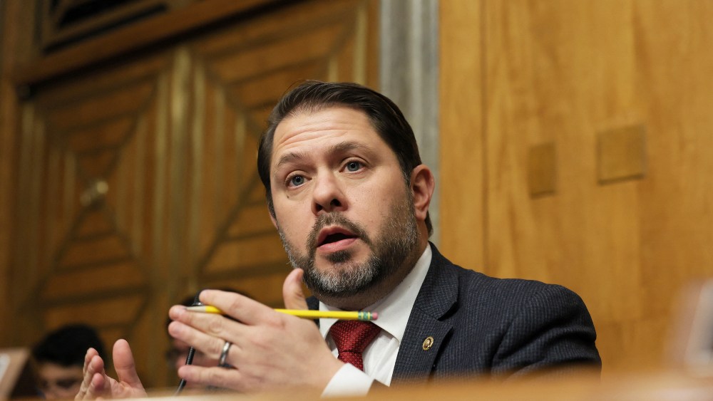 Ruben Gallego speaks while holding a pencil.