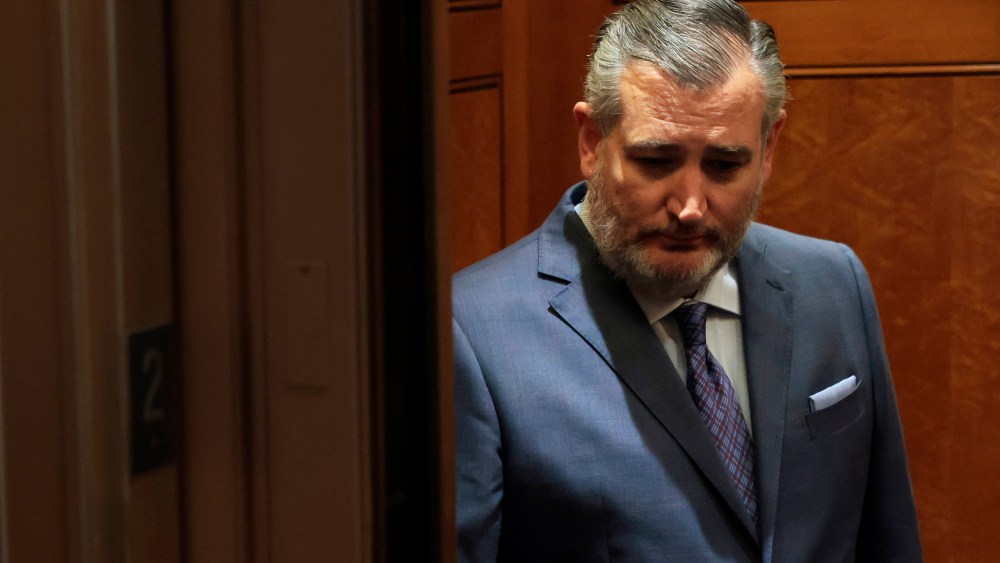 Texas Sen. Ted Cruz looks down as he stands in an elevator in the U.S. capitol.