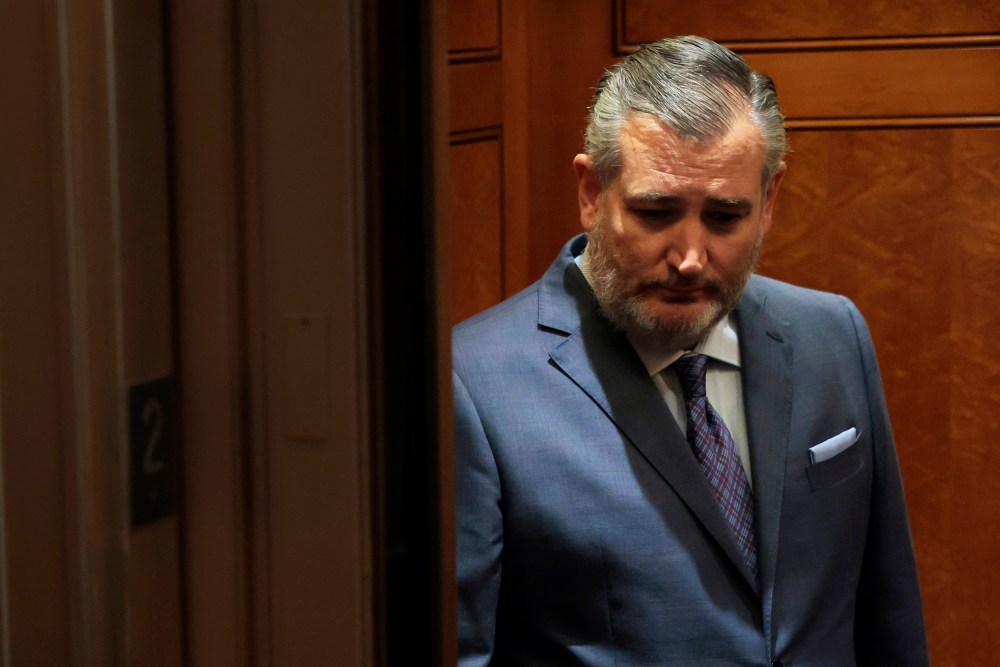 Texas Sen. Ted Cruz looks down as he stands in an elevator in the U.S. capitol.
