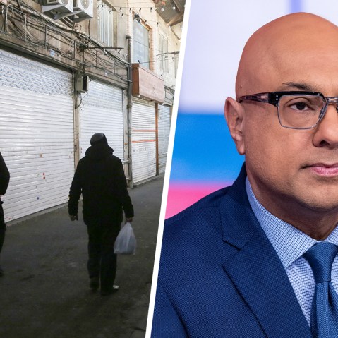 People walk through an empty marketplace with closed vendors; Ali Velshi.