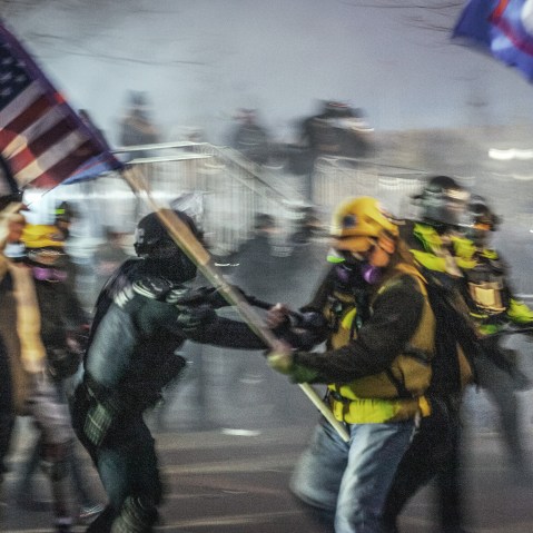 Capitol Police and MPD using physical force and tear gas to force the Trump supporters further away from the U.S Capitol on Jan. 06, 2021.