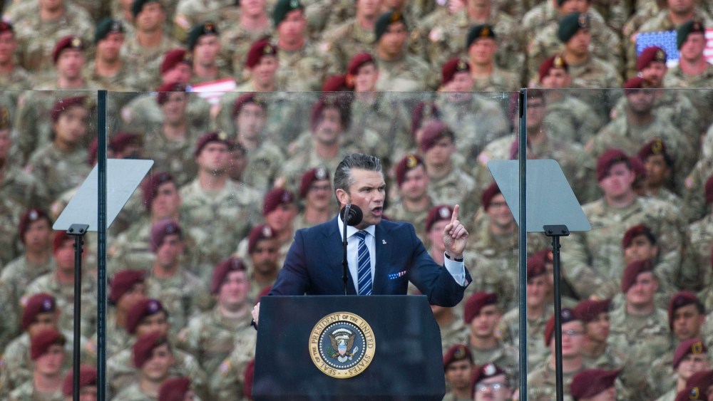 Pete Hegseth in front of a crowd of soldiers.