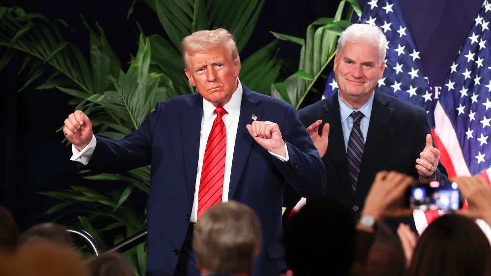 U.S. President Donald Trump dances as House Majority Whip Tom Emmer applauds on Jan. 27, 2025 in Doral, FL.