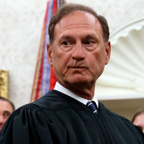 Justice Alito seen in the Oval Office. His face looks nervous.