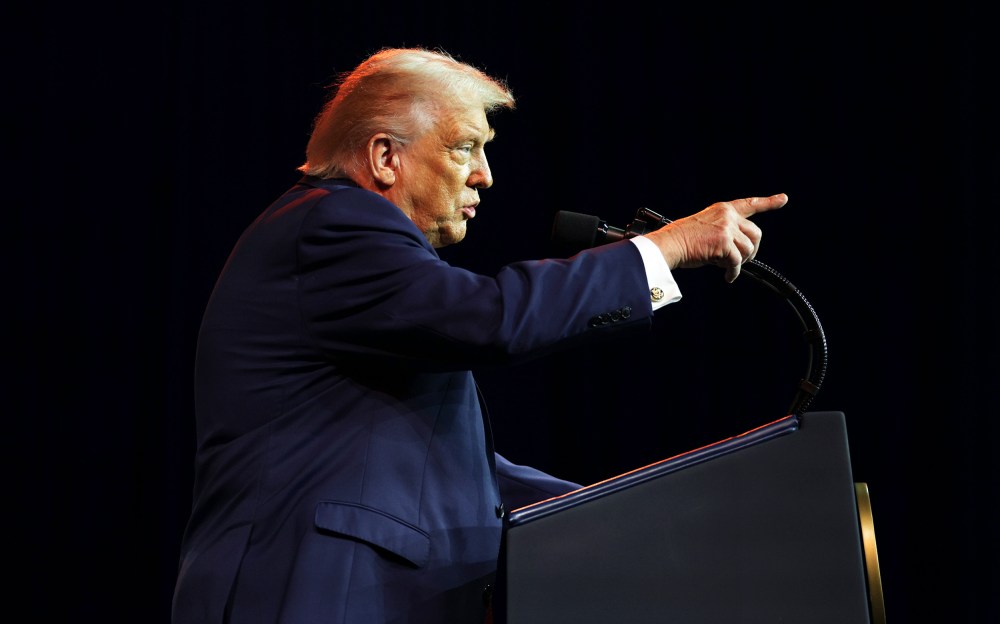 President Donald Trump addresses a House Republican retreat.