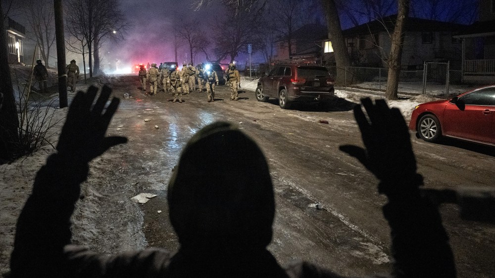 Federal law enforcement officers during confrontations with residents in Minneapolis.