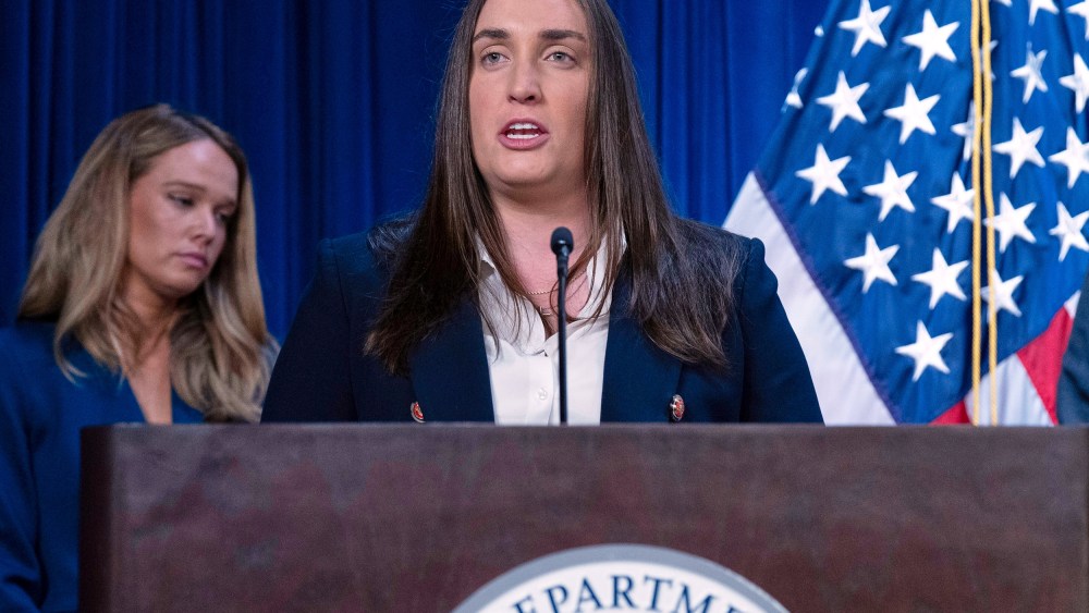 Madison Sheahan speaks at the podium, seen in a tight frame.
