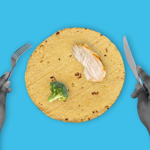 A photo illustration composed of hands holding a knife and fork around a tortilla with a piece of grilled chicken and a piece of broccoli.
