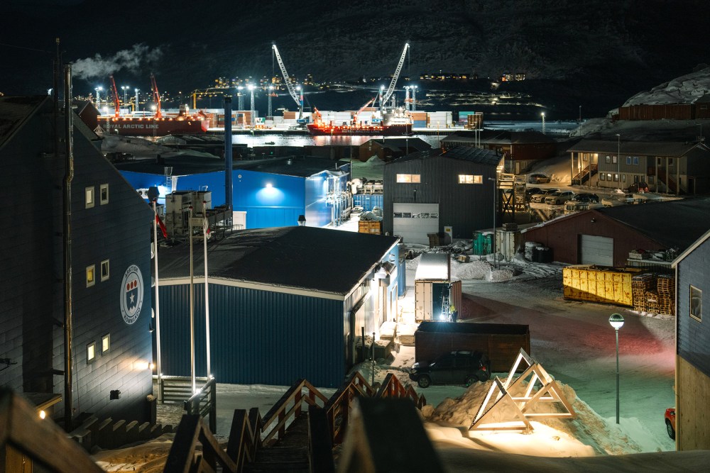 A view of Arctic Command in Nuuk at night, shot from a high angle.