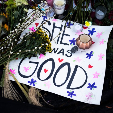 A poster reading "She Was Good" lies at a memorial near the site where Renee Good was killed a week ago, on Jan. 14, 2026 in Minneapolis, MN.