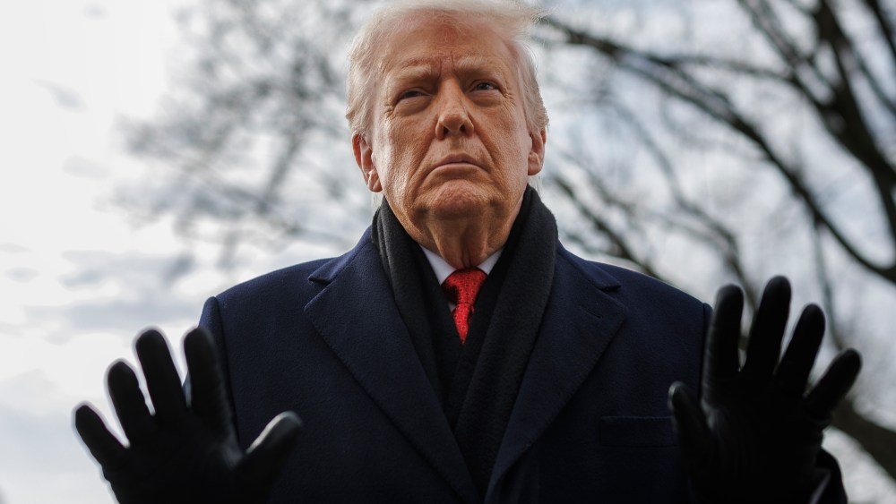 President Donald Trump speaks to reporters on the South Lawn