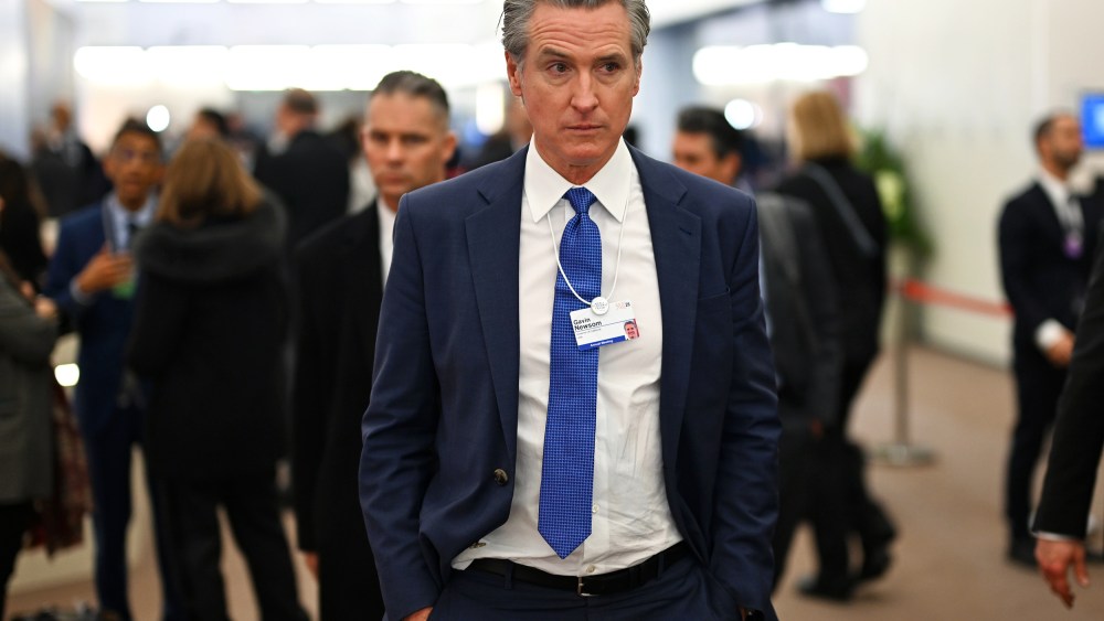 Gavin Newsom walks down a hallway during the World Economic Forum in Davos, Switzerland.