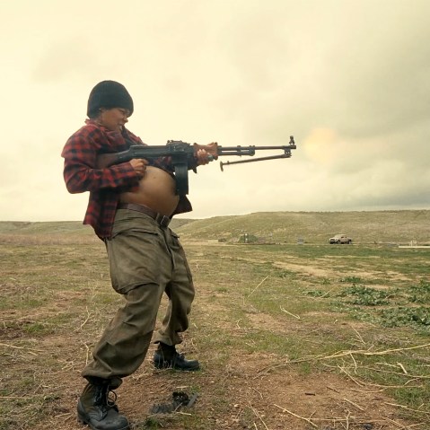 Teyana Taylor as Perfidia Beverly Hills firing a weapon while pregnant in the 2025 film "One Battle After Another."