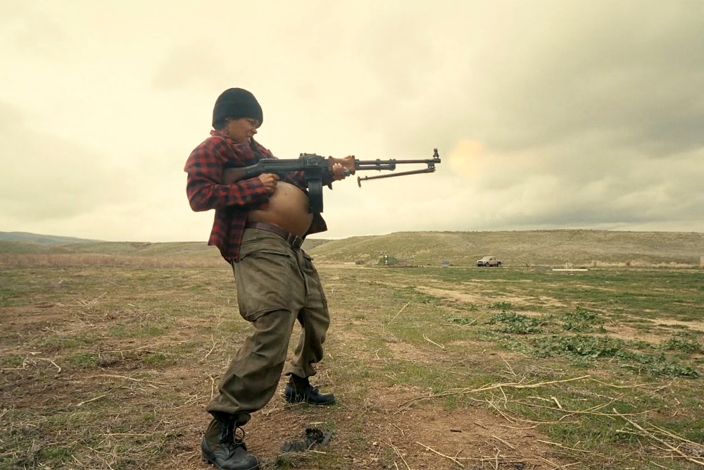 Teyana Taylor as Perfidia Beverly Hills firing a weapon while pregnant in the 2025 film "One Battle After Another."