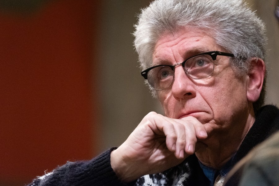 Randall Terry listens a speaker intently at a church.