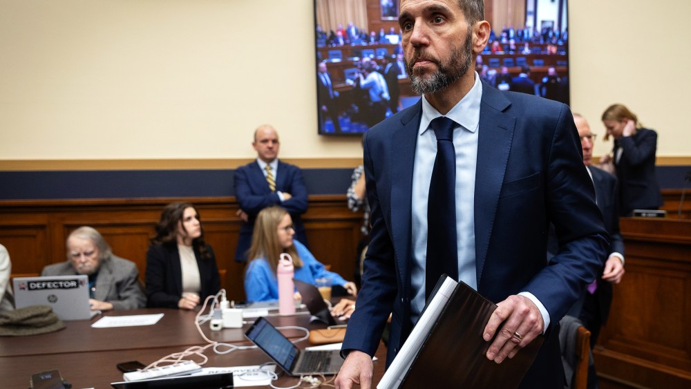 Jack Smith walks toward the desk after a break during his testimony.