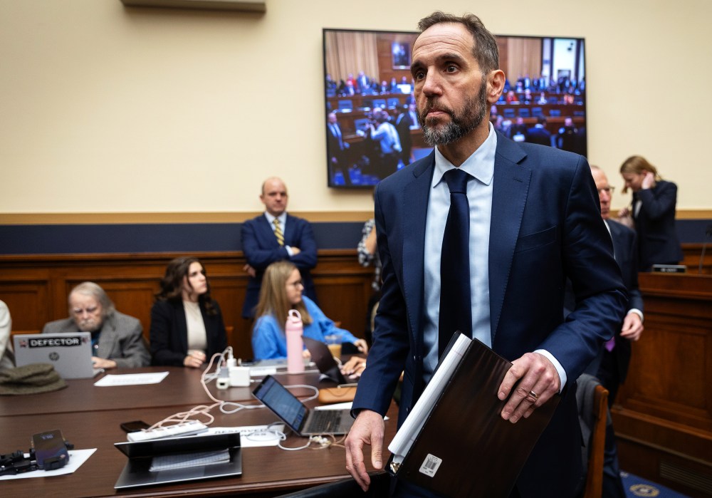 Jack Smith walks toward the desk after a break during his testimony.