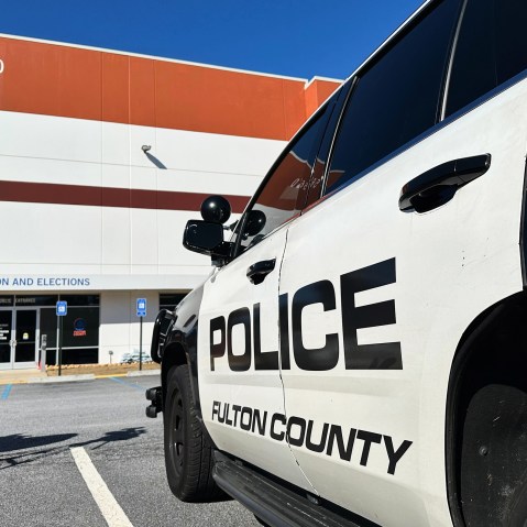 Police vehicles are seen outside the Fulton County elections hub on Jan. 28, 2026, in Union City, Ga.