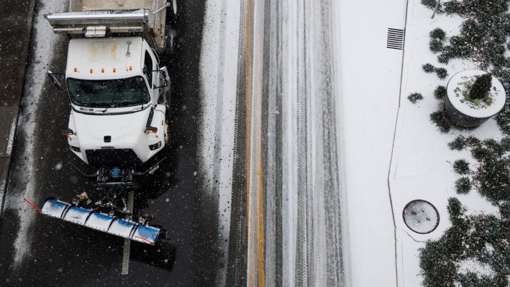 A plow truck drives down First Avenue as snow falls in the lower Broadway area on January 24, 2026 in Nashville, Tennessee. A massive winter storm is bringing frigid temperatures, ice, and snow to millions of Americans across the nation.