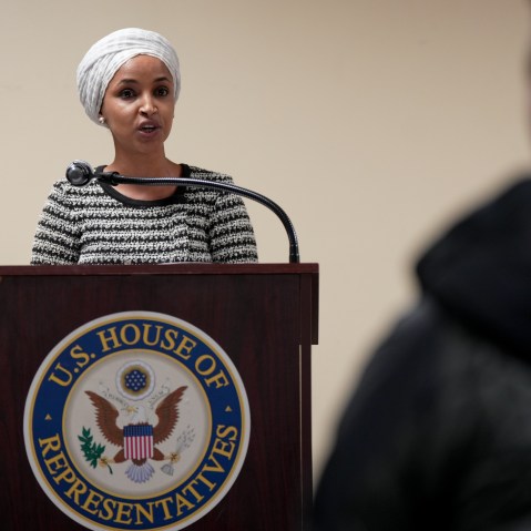 Rep. Ilhan Omar, D-Minn., stands at a podium while at a town hall in Minneapolis, Minnesota.