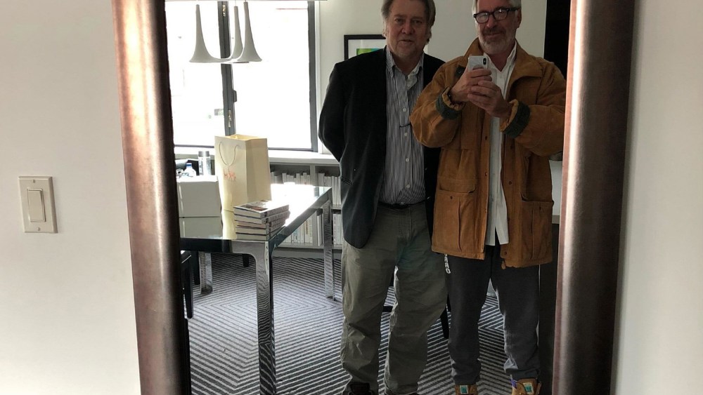 Jeffrey Epstein, right, takes a mirror selfie of him and Steve Bannon.