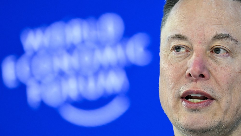 Elon Musk seen speaking in a tight shot.