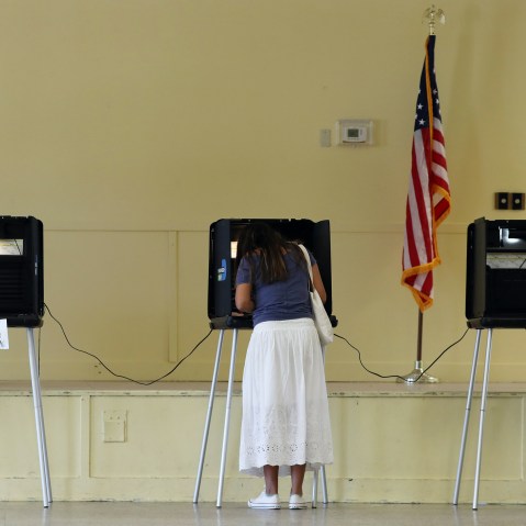 Woman fills out her ballot as she votes on Nov. 03, 2020 in Miami.