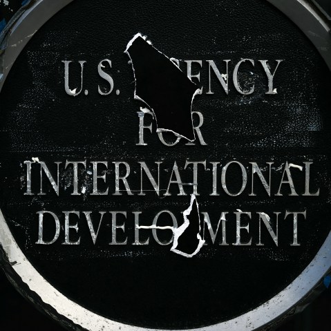 Remnants of signage for the US Agency for International Development (USAID) on the facade of the Ronald Reagan Building and International Trade Center building on Dec. 29, 2025 in Washington, D.C.