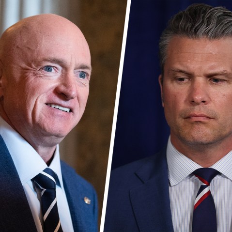 Mark Kelly smiling; Pete Hegseth looking down.